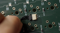 Connect the daughterboard cable to the JST slot on the back of the PCB, pins facing down and the cable going in straight.