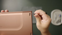 Pressing a silicone foot into the rear recess of the case.