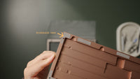 Check that the perimeter of the bottom case has the microsuede pads.