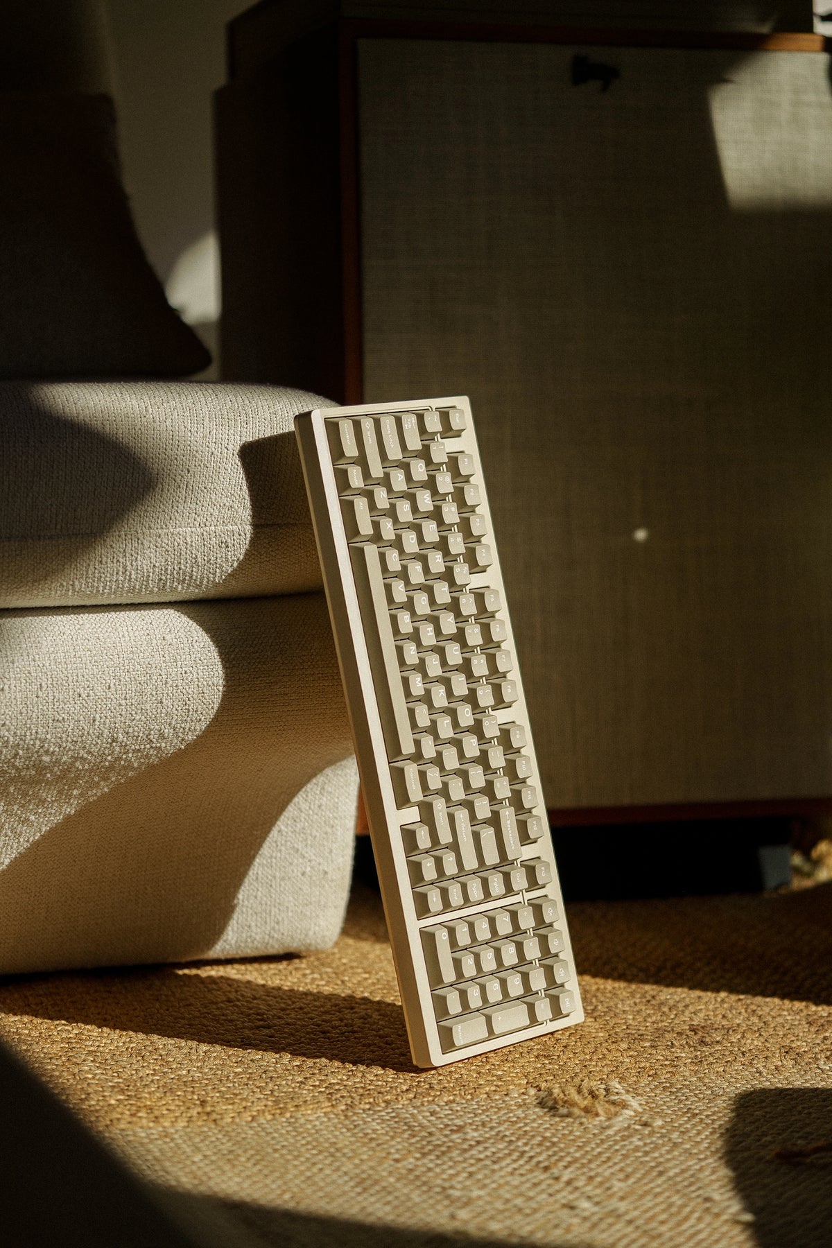 Mode Prologue in Golden Beige standing beside a speaker cabinet