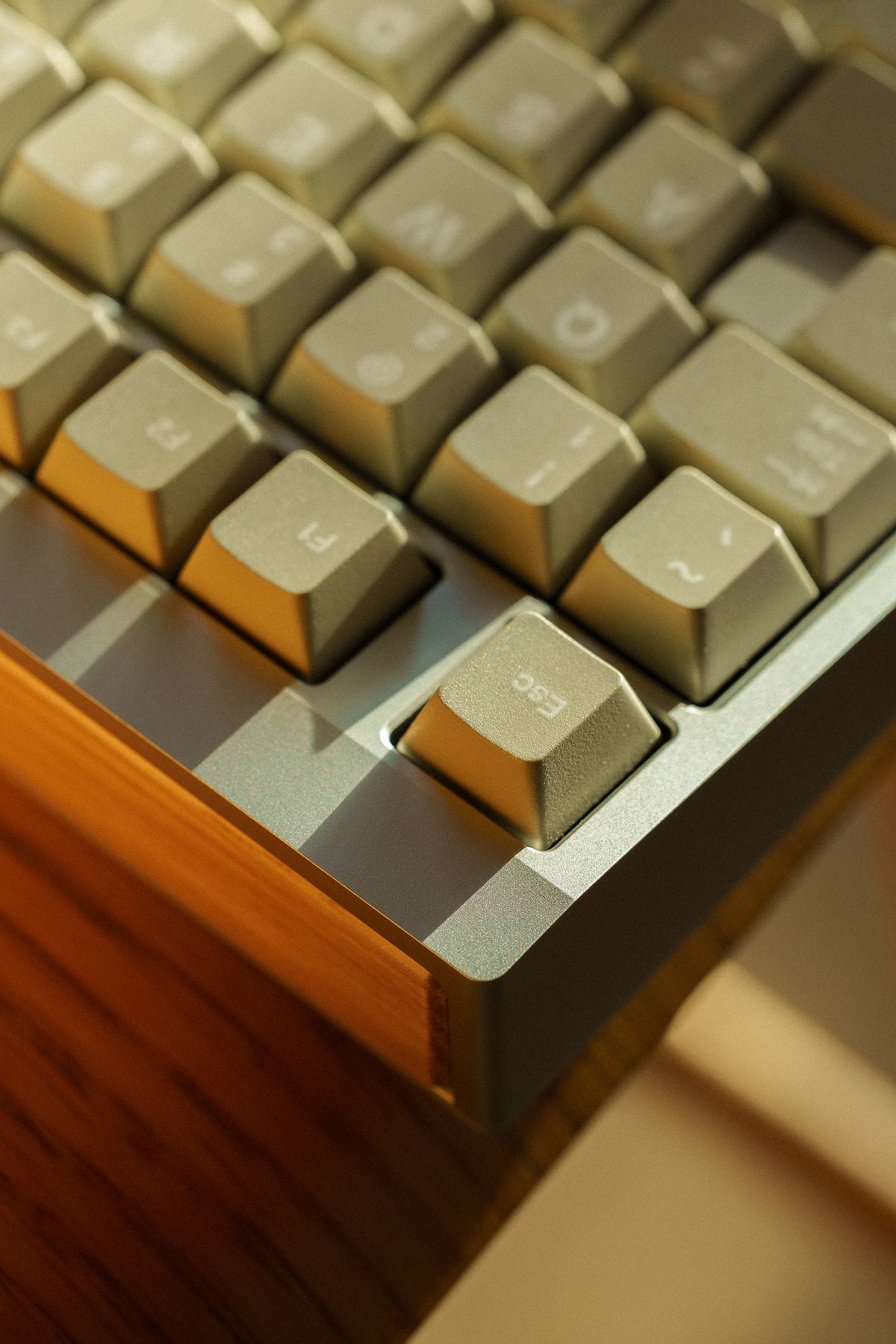 Close-up of the keycaps and front corner of a Mode Prologue in Classic Oak